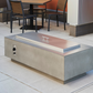 "Enhance your outdoor space with the Cove 54" Linear Gas Fire Pit Table. Propane and natural gas operation. Supercast™ concrete top in White, Midnight Mist, or Natural Grey. Unique color variations and casual pitting add character. Create a warm and inviting ambiance for relaxation and memorable moments."