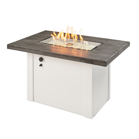 Experience the modern charm of the Stone Grey Havenwood Gas Fire Pit Table. With an Everblend textured top, powder-coated metal base, and a 12" x 24" Crystal Fire® Plus Burner, it's the perfect centerpiece for outdoor gatherings. Handcrafted for unique appeal.