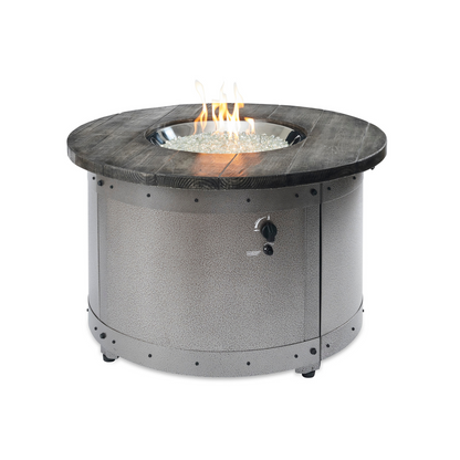 "Craft a unique outdoor space with the Edison Gas Fire Pit Table. Industrial and modern aesthetics combine in this propane and natural gas compatible table. Powder-coated steel base with a Weathered Grey Barnwood Supercast™ concrete top. Experience mesmerizing warmth and style with the UL listed Crystal Fire® Plus burner."