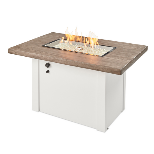 "Step up your entertainment game with the Driftwood Havenwood Gas Fire Pit Table. Propane and natural gas compatible. Unique Driftwood Everblend concrete top. White and Grey powder-coated metal base. 12" x 24" Crystal Fire® Plus Burner creates a cozy glow. Handcrafted Everblend tops offer distinct variations for unique charm."