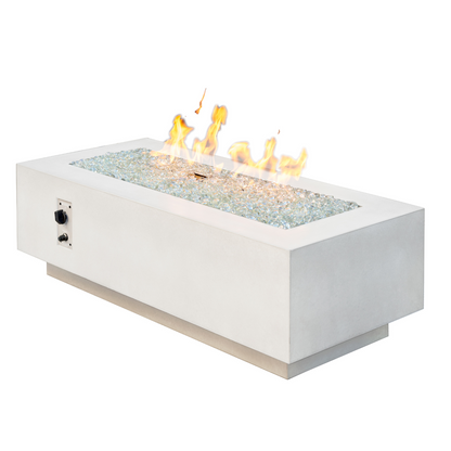 "Enhance your outdoor space with the Cove 54" Linear Gas Fire Pit Table. Propane and natural gas operation. Supercast™ concrete top in White, Midnight Mist, or Natural Grey. Unique color variations and casual pitting add character. Create a warm and inviting ambiance for relaxation and memorable moments."