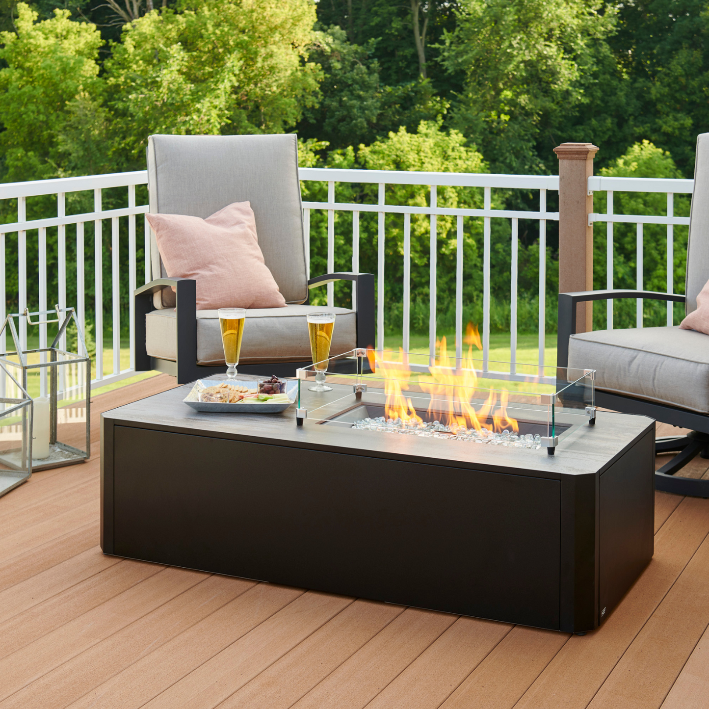 Enhance your outdoor ambiance with the Kinney Fire Pit Table. Its sleek design, low-profile base, and generous tabletop space create a modern and inviting outdoor setting. The 12" x 24" Crystal Fire® Plus Burner adds a cozy touch to your gatherings. Compatible with propane and natural gas.