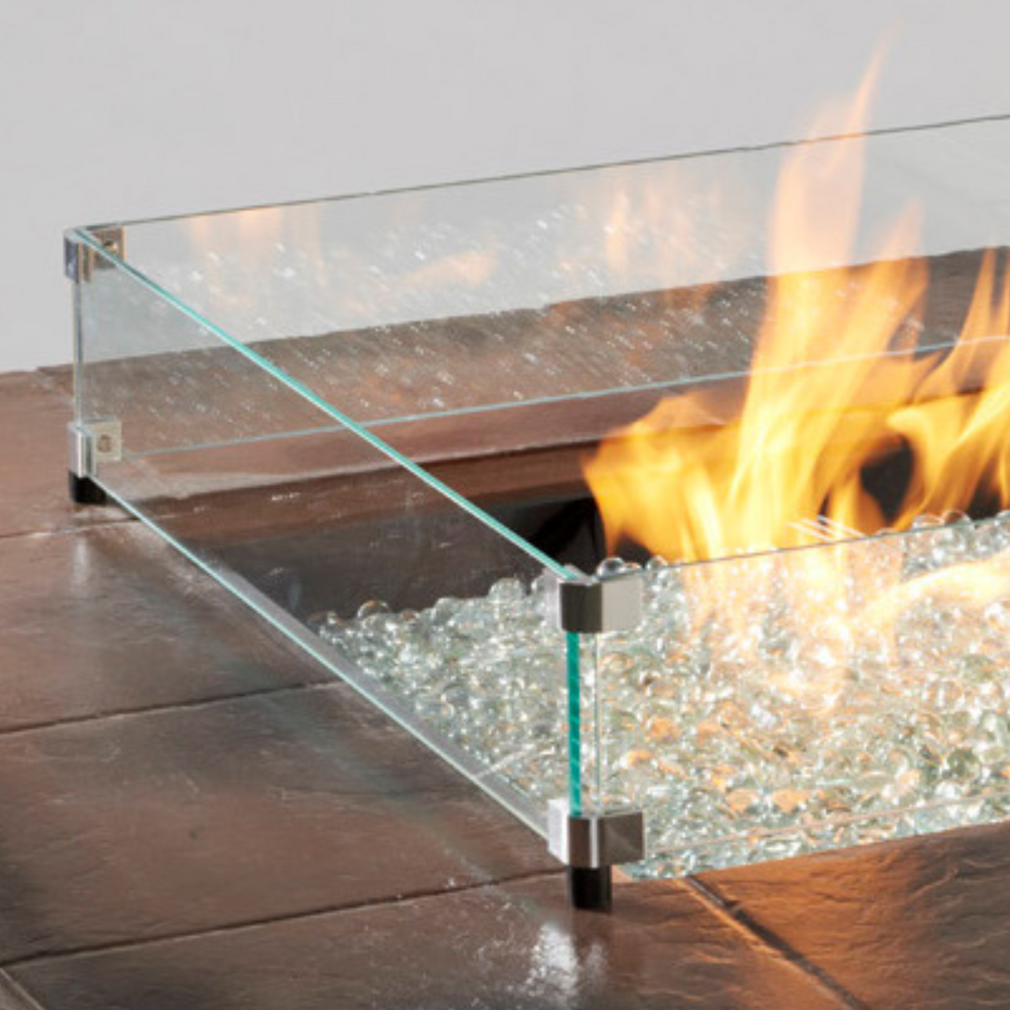 Glass wind guards not only add a layer of protection between the flame, wind, little hands, pets, and debris, but also look beautiful with the reflection of the dancing flame on your gas fire pit table.