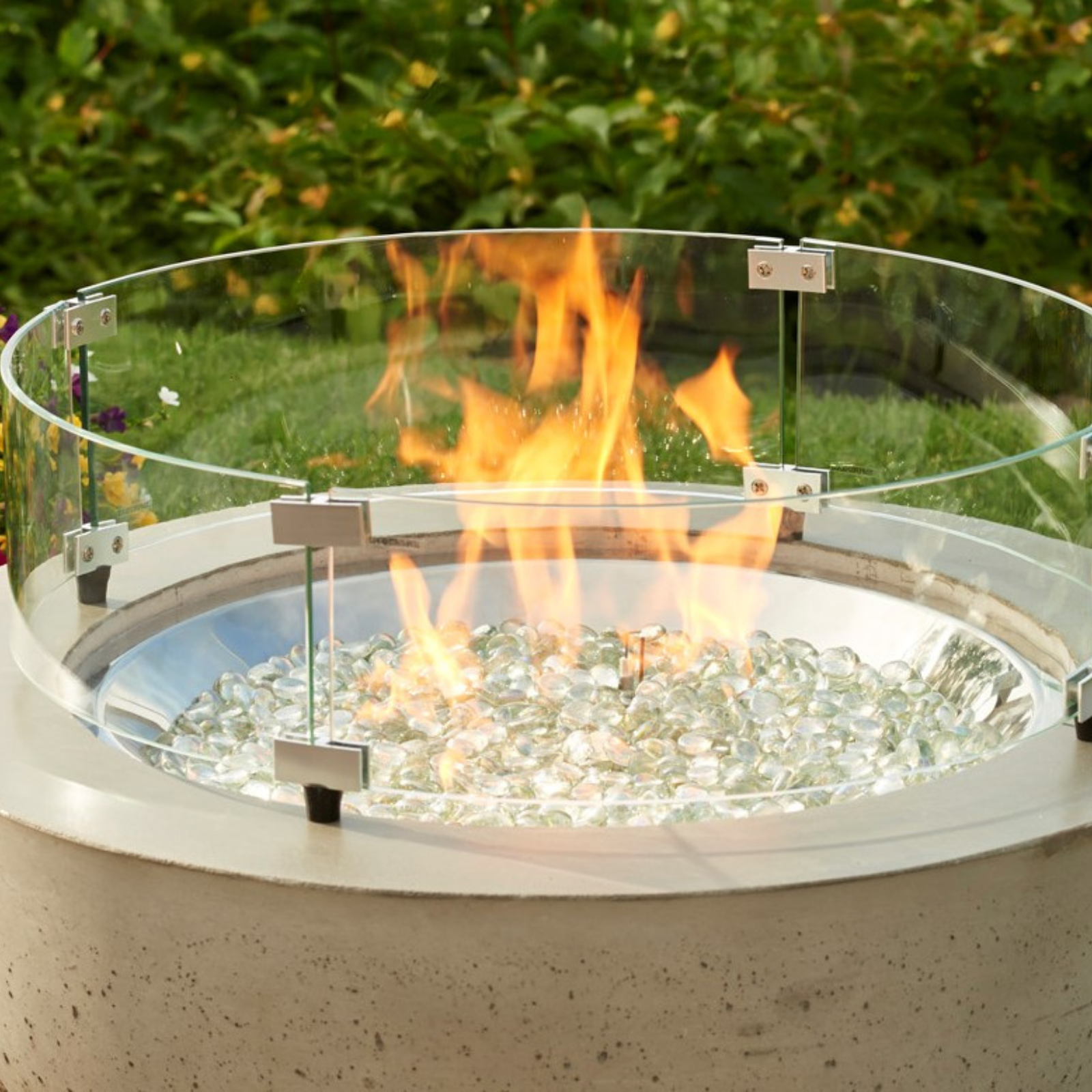 Glass wind guards not only add a layer of protection between the flame, wind, little hands, pets, and debris, but also look beautiful with the reflection of the dancing flame on your gas fire pit table.